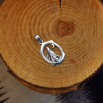 Sterling Silver Wolf Howling at the Moon Pendant – Oval Western Design